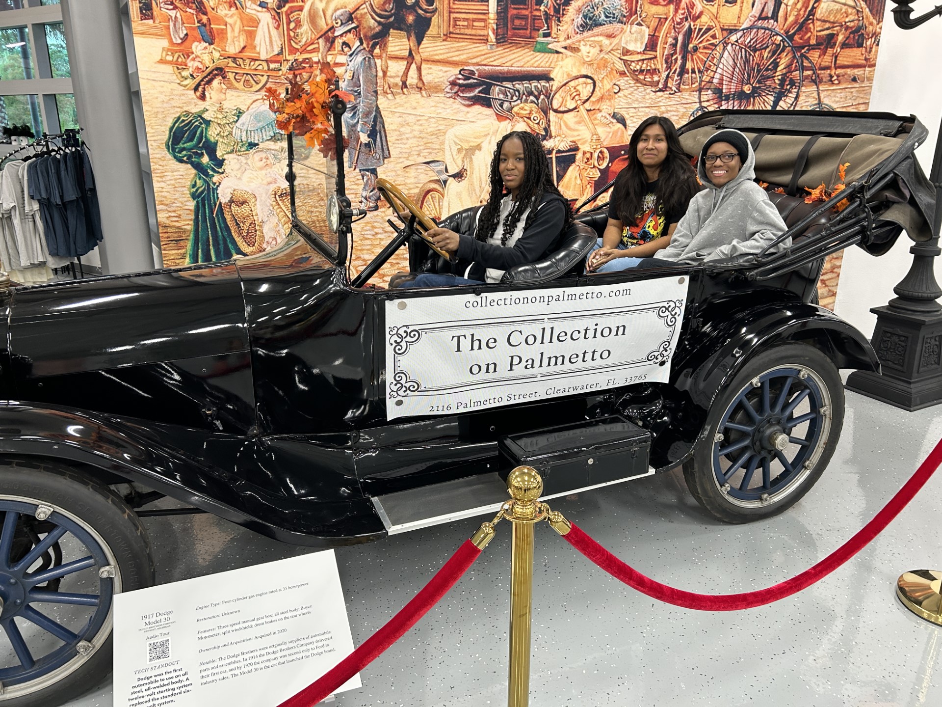 A group of women sitting in a carDescription automatically generated